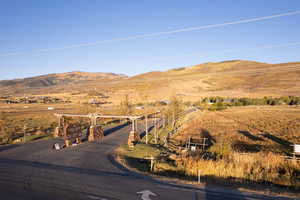 Property view of mountains with a rural view