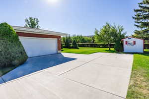 Garage featuring a yard