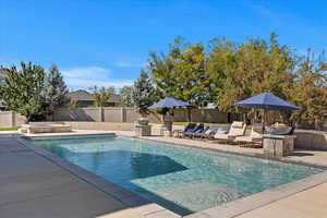 View of swimming pool with a patio