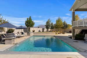 View of swimming pool featuring a patio