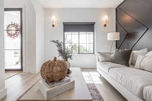 Living room with light hardwood / wood-style floors