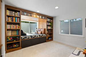 Sitting room featuring carpet floors and a textured ceiling