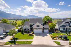 Craftsman house with a front lawn and a mountain view