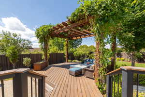 Wooden terrace featuring a pergola