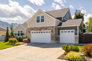 Craftsman inspired home featuring a mountain view and a garage