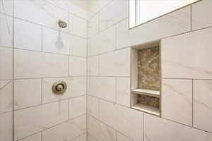 Bathroom with tiled shower