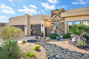 Pueblo-style house with a garage