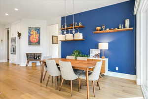 Dining room with light hardwood / wood-style floors