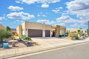 Adobe home featuring a garage