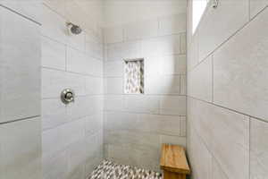 Bathroom with a tile shower