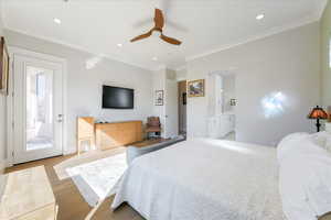 Bedroom featuring crown molding, ceiling fan, light hardwood / wood-style flooring, access to outside, and ensuite bath