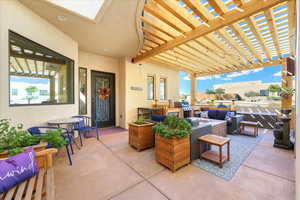 View of patio / terrace with a pergola, an outdoor living space, and area for grilling