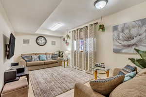 Living room featuring light tile patterned floors