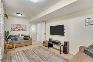 Living room with light tile patterned flooring