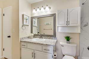 Bathroom with vanity and toilet