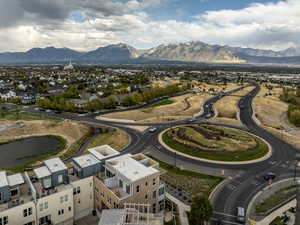 Check out your future stunning view of the east mountain range framing the Salt Lake Valley from your home, shown from the back here at the center bottom of the photo.