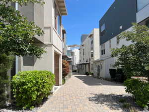 Beyond your garage and down the sidewalk you will find this charming cobblestone walkway, hidden from traffic, which leads right to the lake.