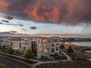 Welcome to this luxury Daybreak townhome just steps from the water, featuring unobstructed mountain views framing the Salt Lake Valley down to Timpanogos and beyond.