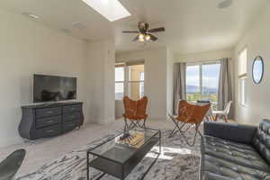 Built-in speakers and a media wall wired for cable and internet make for a perfect entertainment space in this great room in the sky.