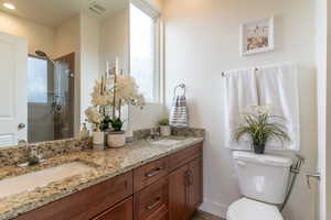 The private primary bathroom features 2 sinks, granite countertops and a generous sized shower.