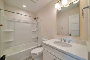 Full bathroom with shower / bathing tub combination, vanity, and toilet