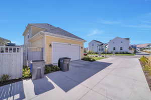 View of property exterior featuring a garage