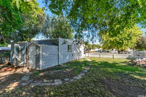 View of yard featuring a storage shed