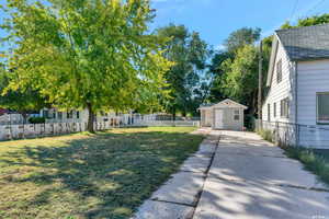 View of yard with a storage shed