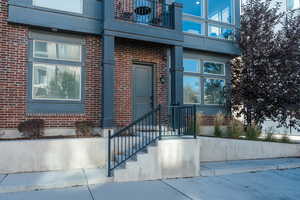 Property entrance featuring a balcony