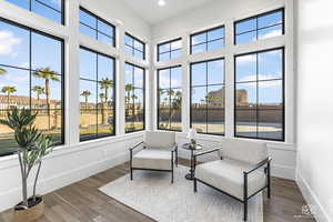 Living area with dark hardwood / wood-style floors