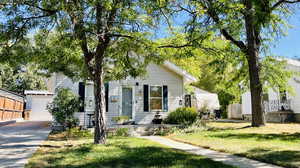 View of front of home featuring a garage and a front lawn