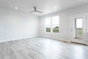 Interior space featuring ceiling fan and light wood-type flooring