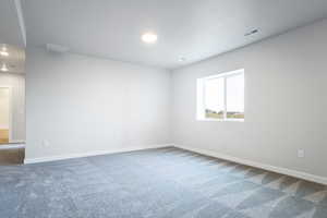 Empty room with carpet flooring