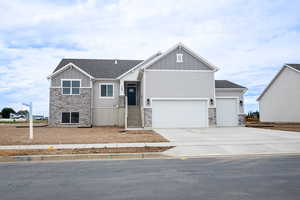 View of front facade featuring a garage