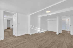 Spare room featuring carpet floors