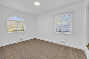 Spare room with carpet floors