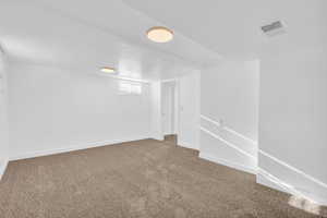 Basement with carpet