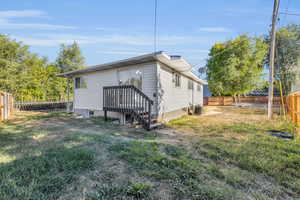 View of property exterior featuring cooling unit and a lawn