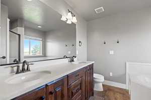 Master Bathroom with double vanity, a beautiful jetted tub and a walk-in-shower