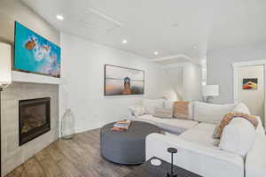 Living room with hardwood / wood-style flooring and a fireplace