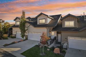 View of front facade featuring a garage