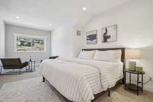 Bedroom with light colored carpet