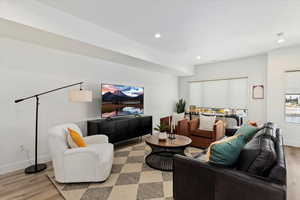 Living room with light hardwood / wood-style floors