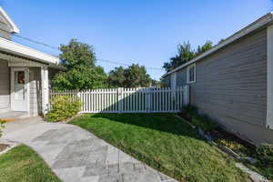 Grassy area between home and garage.