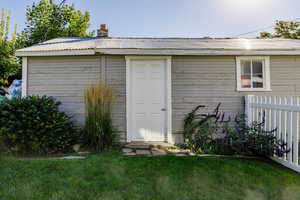 Side door entrance to detached garage.