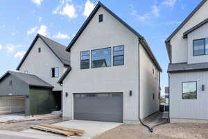 View of back facade with a garage