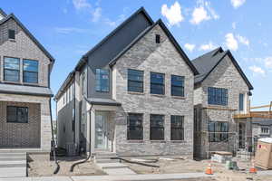 View of front of home featuring central AC