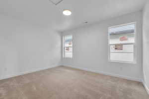 Unfurnished room with light colored carpet