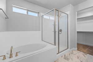 Bathroom featuring independent shower and bath