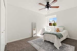 2nd bedroom upstairs with ceiling fan, natural light, and a closet